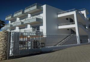 a white building with balconies on the side of it at Residencial Campo-Mar by Umbral in Portimão +14 photos