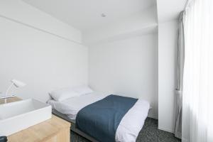 Katil atau katil-katil dalam bilik di Imu Hotel Kyoto