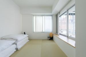 Katil atau katil-katil dalam bilik di Imu Hotel Kyoto