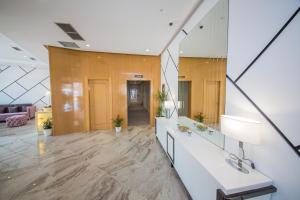 an office lobby with a reception desk and a mirror at Sole Luna Hotel in Borsh