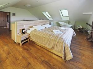 Posteľ alebo postele v izbe v ubytovaní Hotel Vinohrad