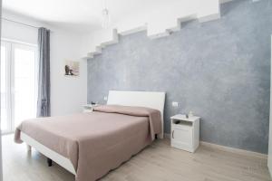 Uma cama ou camas num quarto em Apulianstay-Chiarabella