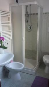 a bathroom with a shower and a toilet and a sink at B&B Stella dell'Adriatico in Ortona +42 photos