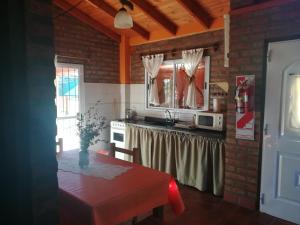 Kuchyň nebo kuchyňský kout v ubytování Cabañas Valentina