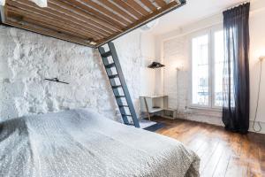 Łóżko lub łóżka w pokoju w obiekcie Cosy 40m² near MONTMARTRE