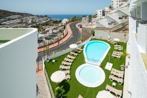 arial view of a balcony with a swimming pool at Montesol Atsol in Puerto Rico de Gran Canaria