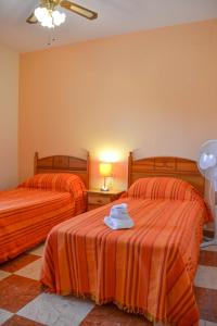 En eller flere senge i et værelse på Traumhaus für 6 Personen mit spektakulärem privaten Pool und schönem Ausblick in die Natur + 93 billeder