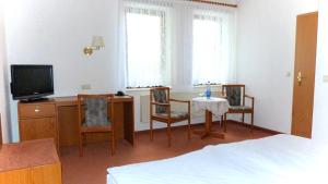 TV a/nebo společenská místnost v ubytování Hotel Mühlenhof