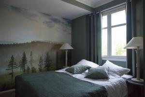Säng eller sängar i ett rum på Boutique hotel Sawohouse