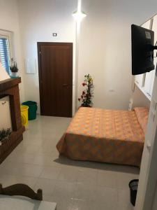 A bed or beds in a room at B&B Tra gli ulivi