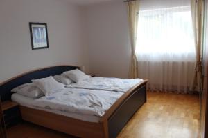 Postel nebo postele na pokoji v ubytování Ferienwohnung by Josef Lanzinger