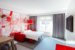 Ein Bett oder Betten in einem Zimmer der Unterkunft Radisson RED Brussels
