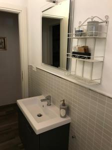 a bathroom with a sink and a mirror at casamariu in Lucca +20 photos