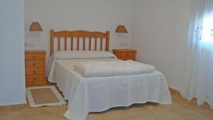 Tempat tidur dalam kamar di Mariarosa Sol