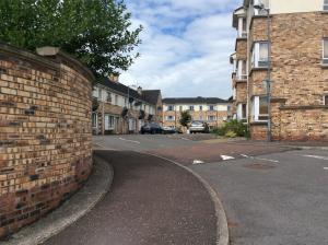 an empty street in a town with brick buildings at The Sidings in Enniskillen