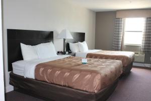 Postel nebo postele na pokoji v ubytování Quality Inn & Suites Port Arthur - Nederland
