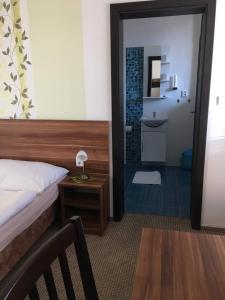 Postel nebo postele na pokoji v ubytování Hotel Jordánek