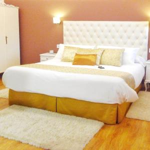 Cama o camas de una habitación en A Cantaruxa Maruxa Turismo Rural