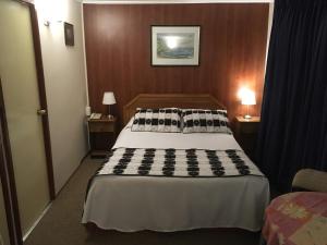 Letto o letti in una camera di Hotel Luanco