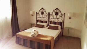 Postel nebo postele na pokoji v ubytování B&B rizziettu