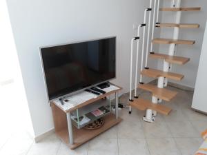 TV a/nebo společenská místnost v ubytování House Barizoni