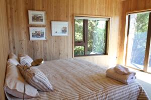 Postel nebo postele na pokoji v ubytování Casas Martín Pescador, Lago Huillinco, Chiloe