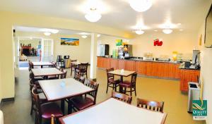 a restaurant with tables and chairs and a counter at Quality Inn Price Gateway to Moab National Parks in Price +18 photos