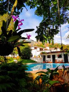 a view of a swimming pool in a garden at Ayenda 1257 Premium Real in Medellín