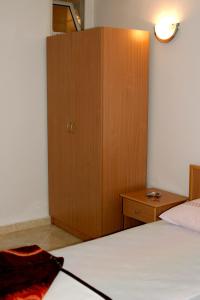 Postel nebo postele na pokoji v ubytování Omega Apartments