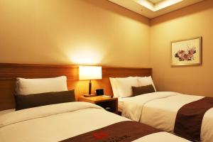 Postel nebo postele na pokoji v ubytování Bridge Hotel Incheon Songdo