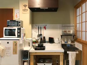 Dapur atau dapur kecil di Suzuki Guesthouse