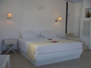 Ένα ή περισσότερα κρεβάτια σε δωμάτιο στο Solaris