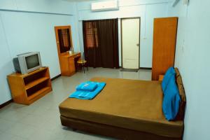 Postel nebo postele na pokoji v ubytování AEK Apartment