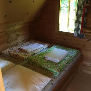 Кровать или кровати в номере Lønstrup Egelunds Camping & Cottages