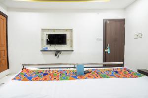Postel nebo postele na pokoji v ubytování FabHotel ABC View