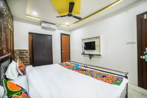Postel nebo postele na pokoji v ubytování FabHotel ABC View