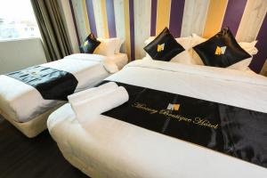 Postel nebo postele na pokoji v ubytování Mercury Boutique Hotel