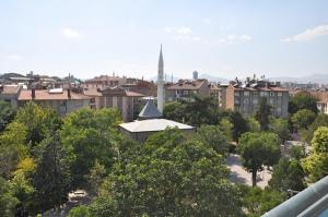 a view of a city with a church and trees at MEVLANA ŞEMS HOTEL in Konya