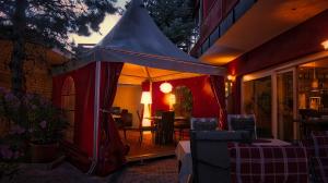 a tent is set up on the side of a building at Fritz Hotel & Restaurant KG in Weil am Rhein