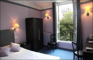 Postel nebo postele na pokoji v ubytování Best Western Hotel Le Guilhem