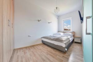 Posteľ alebo postele v izbe v ubytovaní Apartamenty Sun & Snow Seaside Grzybowo
