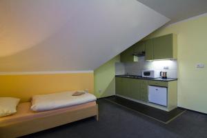 Postel nebo postele na pokoji v ubytování Apartmány Sport with Garage