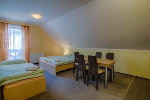 Postel nebo postele na pokoji v ubytování Apartmány Sport with Garage