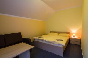Postel nebo postele na pokoji v ubytování Apartmány Sport with Garage