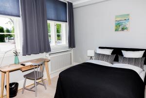 Postel nebo postele na pokoji v ubytování Hotel Fredensborg Store Kro