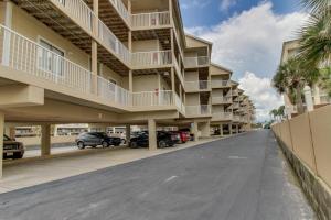 an empty street in front of a building at Romar Beach Condos in Gulf Shores