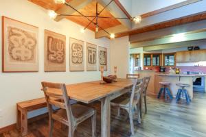 a dining room with a wooden table and chairs at RiverPoint Retreat in Sandpoint
