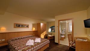 Postel nebo postele na pokoji v ubytování Hotel Sole + 25 fotografií