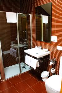 Koupelna v ubytování Hotel Alda Entrearcos
