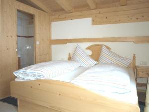 Postel nebo postele na pokoji v ubytování Chalet Der Tyroler Adler im Zentrum vom Wilden Kaiser